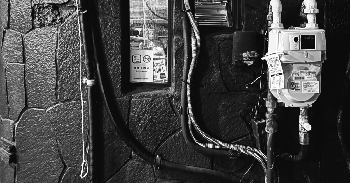 A black and white photo of wiring and a meter.